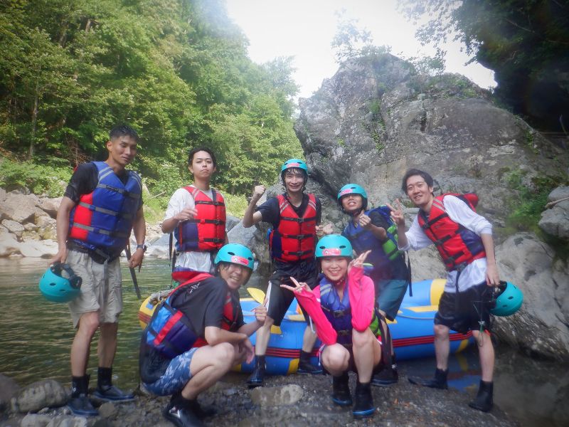 A collage of happy customers smiling and giving thumbs-up during their rafting tour.