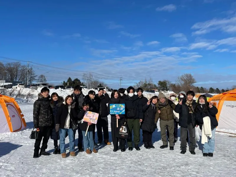 Warm winter clothing including a ski jacket, snow pants, gloves, and a winter hat.