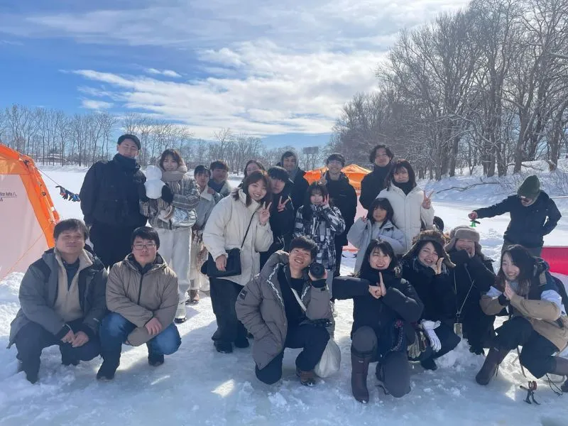 A friendly guide teaching a child how to fish.